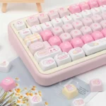 Sweet cat keycaps set, PBT MOA profile, shown from various angles. Whimsical pastel feline designs highlight durable PBT for cozy, playful keyboard charm.