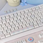 Playful Sweet Marshmallow PBT Dye-Sub Keycaps set in soft pastel hues, showcased from multiple angles, revealing their whimsical design and cozy aesthetics.