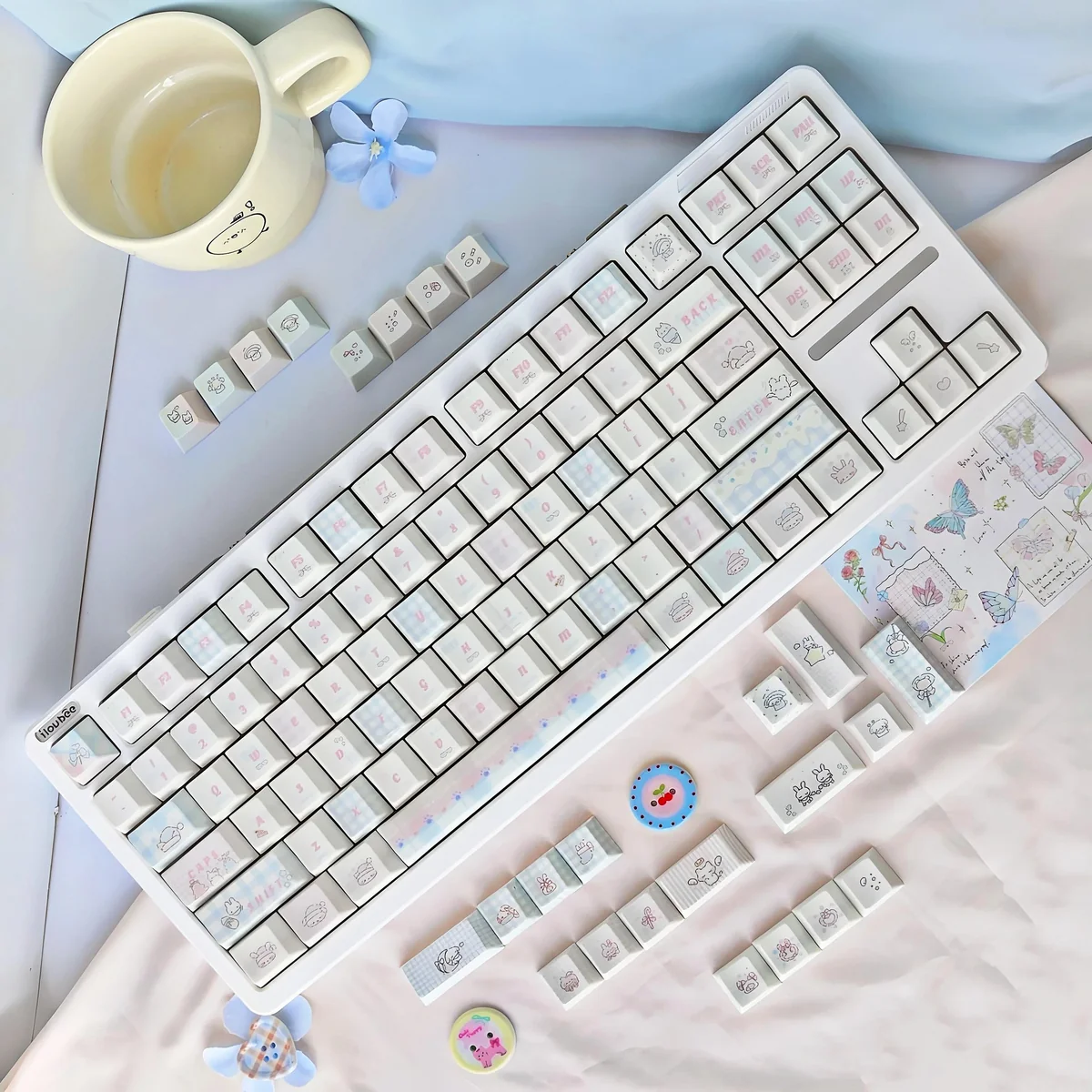 Sweet Marshmallow PBT Dye-Sub Keycaps set with soft pastel hues, showcasing its whimsical design for a cozy aesthetic.