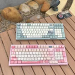 A charming close-up of Sweetheart Party MDA PBT keycaps set, highlighting soft pastel colors and playful dye-sub dessert motifs from a unique angle.