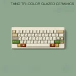 Tang Tri-Color Uyghur PBT keycaps set in a gallery view, revealing rich earthy glazes and unique artistic Uyghur legends from every angle.