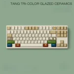 Tang Tri-Color Uyghur PBT Keycaps Set from various angles, showcasing the rich earthy glazes and distinctive Uyghur legends. Artistic and unique.