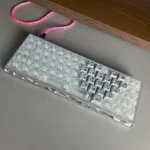 Multiple angles of premium forged carbon keycaps set, highlighting their unique texture and sleek side-lit legends for an immersive gaming experience.