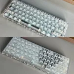 Premium forged carbon keycaps set display their unique texture and sleek side-lit legends, perfect for a high-tech gaming setup.