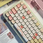 Vibrant red and white PBT dye-sub Valentine keycaps set display playful hearts and sweet love motifs, perfect for romantic keyboard expression.