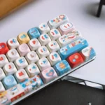 Western Cat MOA PBT keycaps set. Detailed view of durable PBT material with playful cowboy cat designs, highlighting comfortable MOA profile from the Adventure setup.