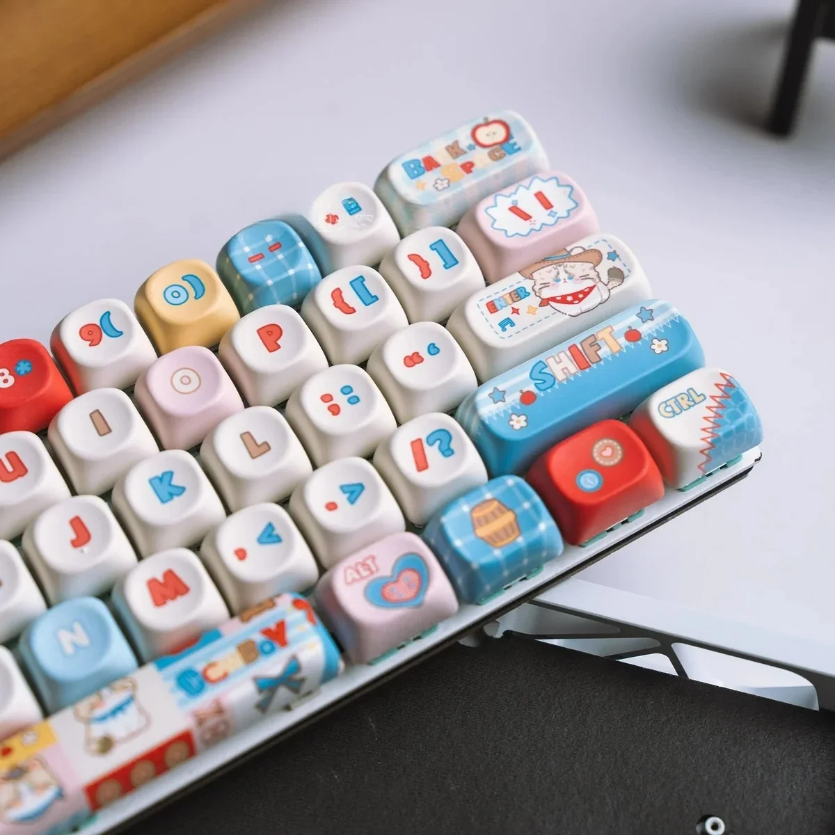 Western Cat MOA PBT keycaps set. Detailed view of durable PBT material with playful cowboy cat designs, highlighting comfortable MOA profile from the Adventure setup.