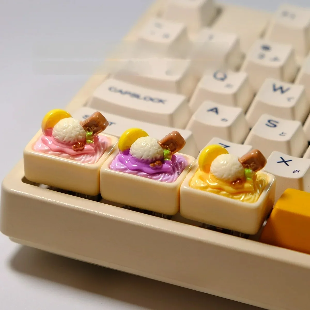 Multiple angles of the whimsical handcrafted ice cream keycap, highlighting its realistic miniature scoops and vibrant pastel details. A charming, edition.