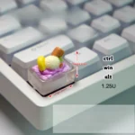 Whimsical translucent purple handcrafted ice cream keycap, a charmingly edible miniature accent for mechanical keyboards.