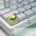 Whimsical handcrafted ice cream keycap in a delightful translucent green, capturing a realistic miniature scoop with a playful, edible aesthetic.