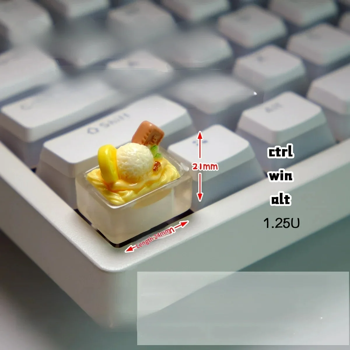 Charming handcrafted translucent yellow ice cream keycap, a playful miniature scoop with an edible aesthetic.