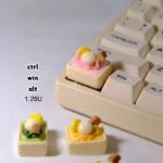 Whimsical handcrafted ice cream keycap product gallery, displaying its realistic miniature scoops and vibrant pastel details from multiple charming perspective.