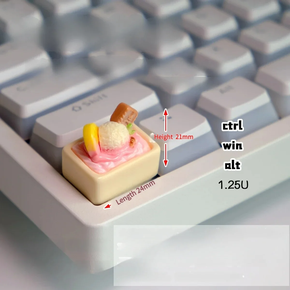 Playful handcrafted pink ice cream keycap, a realistic miniature scoop in vibrant pastel, offering a charming edible accent for keyboards.