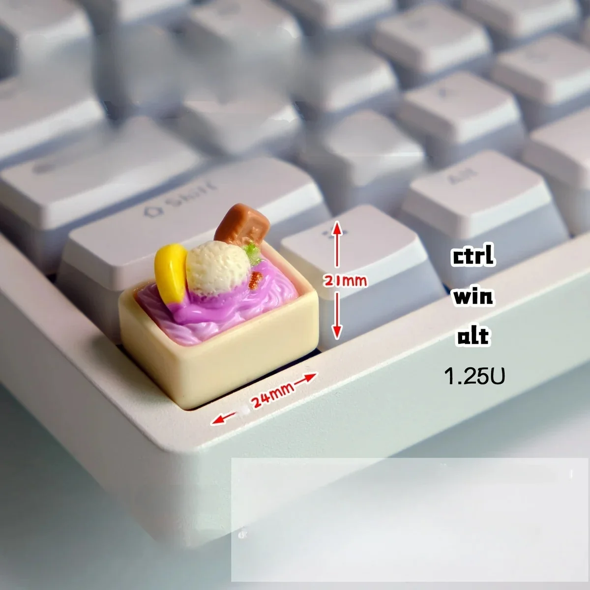 Whimsical handcrafted purple ice cream keycap, a realistic miniature scoop for your keyboard, adding a playful pop of color.