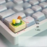 Playful handcrafted ice cream keycap in a vibrant pastel green, showcasing a realistic miniature scoop that looks good enough to eat.