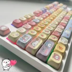 Whimsical Joke Bear PBT Dye-Sub MOA keycap set showcasing charming character art and soft pastel palettes from various angles.