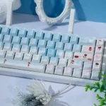 Winter Romance PBT Dye-Sub keycaps Set, shown from various angles. The premium 120-key set features soft pastel blue and pink, creating a serene, cozy winter setup.