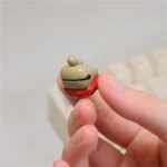 A gallery of images featuring the Handcrafted Wooden Fish Keycaps, detailing its meditative wooden fish design for mechanical keyboards.