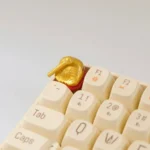 Close-up views of the Handcrafted Wooden Fish Keycaps, showcasing its detailed wooden fish design from multiple artistic angles for mechanical keyboard.