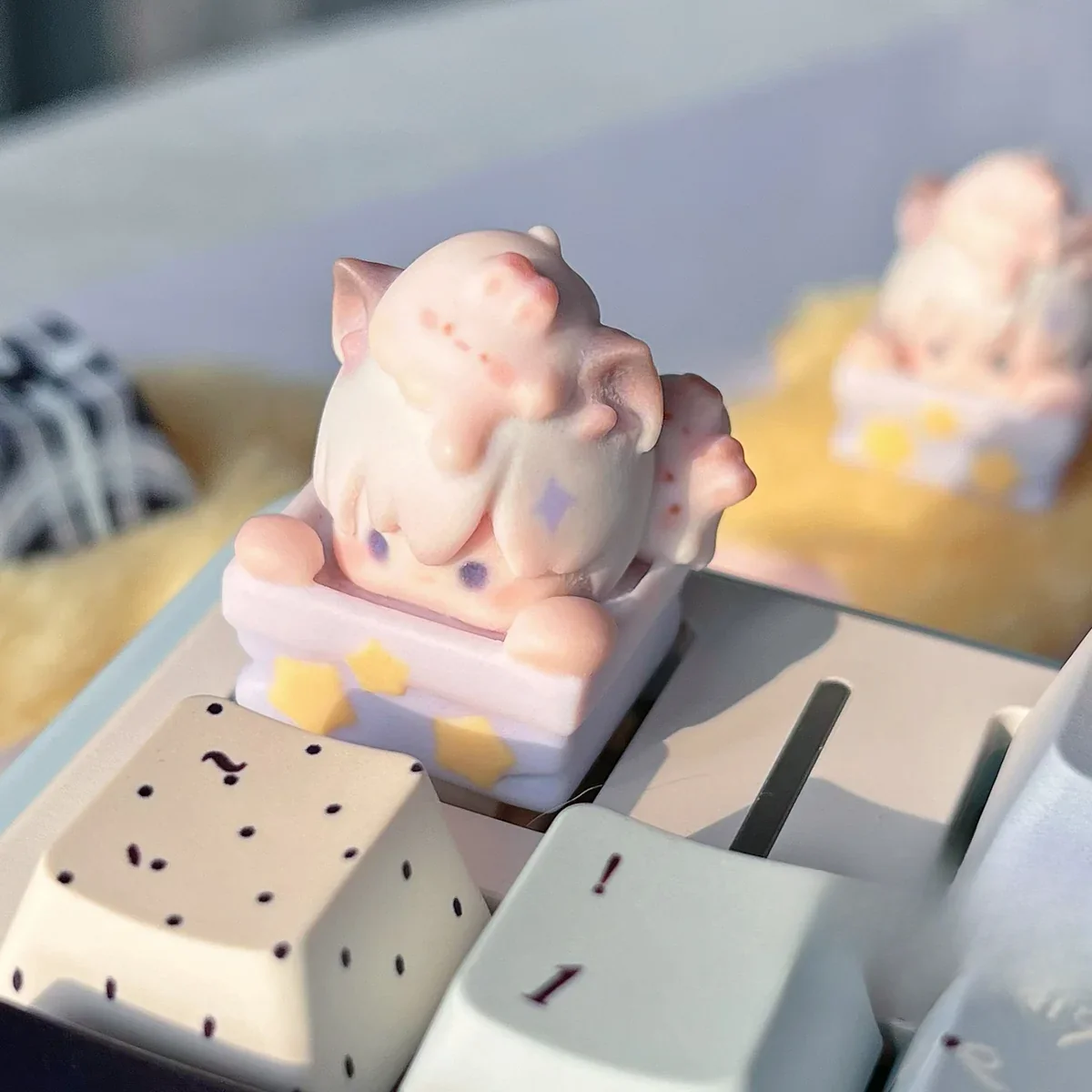 Xavier Celestial Artisan Keycap. Gallery views highlight its dreamy sculpt, intricate details, and luminous Love & Deep Space accents from all angles.