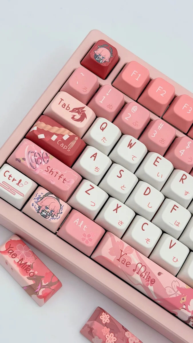 An exclusive Yae Miko Genshin Impact MDA keycap set, showcased from multiple artistic angles, revealing elegant mystical fox motifs and vibrant character design.