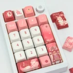 Exclusive Yae Miko Genshin Impact MDA keycap set, beautifully displayed from various angles, revealing intricate mystical fox motifs and elegant character design.