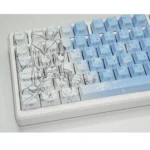 Gallery of Yukino Keycaps Set, showcasing the cool gradient blue side-lit PBT design from multiple angles. Emphasizes minimalist legends and subtle anime design.