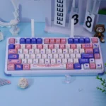 Ethereal Mechanical Angel Keycaps set: a premium dye-sub PBT set in soft pastel blue and pink, displaying a dreamy celestial angel motif.