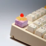 Multiple angles of the handcrafted, delectable strawberry cream artisan keycap, showcasing its vibrant, whimsical dessert layers.