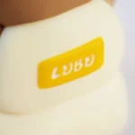 Whimsical artisan resin ESC keycap featuring a miniature bear on a sofa. Intricately handcrafted, its charming layered design is highlighted in details.