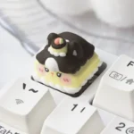 Close-up gallery view of a handcrafted Whimsical Foodie Creature Resin ESC Keycap, showcasing adorable food creatures with vibrant colors and intricated design.