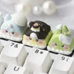 Whimsical handcrafted artisan resin keycap featuring an adorable miniature food creature on an ESC key, vibrant and intricately sculpted.