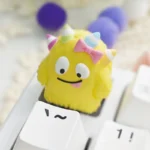 Captivating views of the Whimsical Monster ESC artisan resin keycap, featuring unique handcrafted little monster designs. Vibrant, layered design.