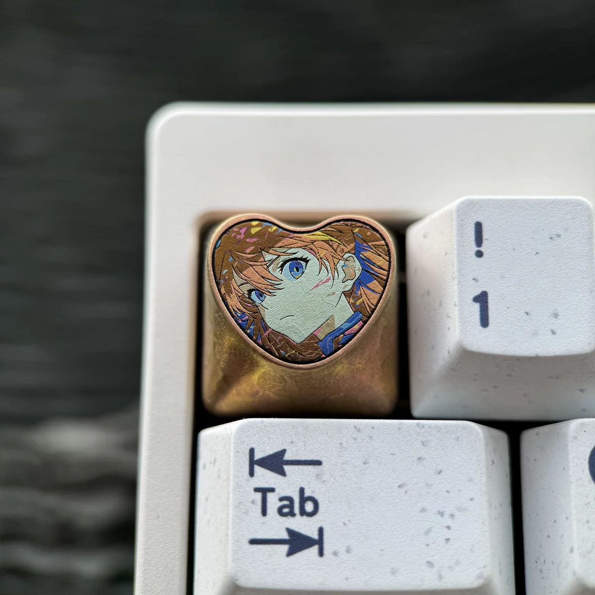 Handcrafted Asuka Titanium Heart ESC keycap, a premium fandom art piece showcasing iconic colors and a meticulously crafted metallic finish.