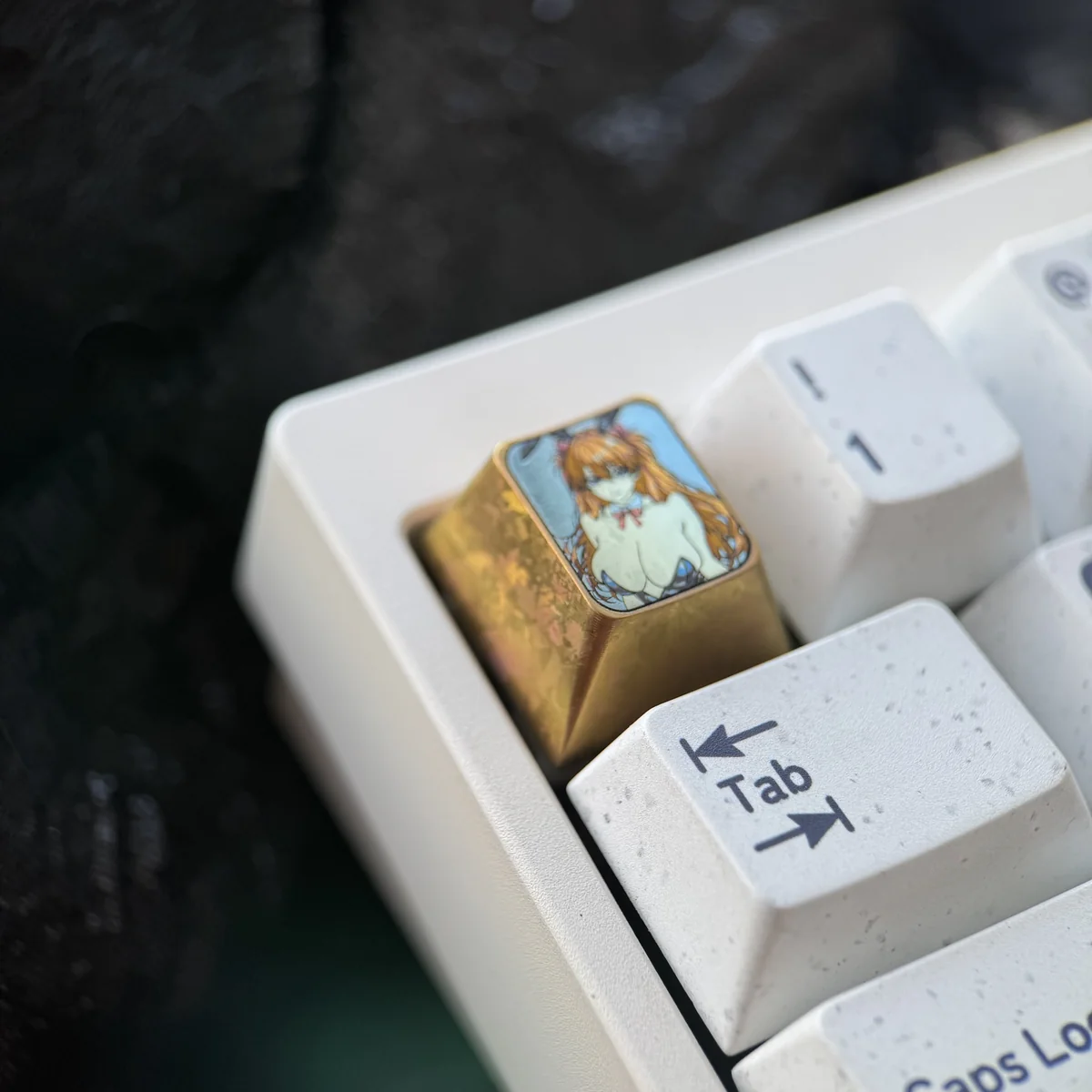 Close-up gallery of the premium titanium Asuka Bunny Girl artisan keycap, highlighting intricate detail and vibrant anime design from various perspective.