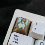 Premium titanium Asuka Bunny Girl artisan keycap, detailed from multiple angles, showcasing its vibrant anime art and exquisite metallic craftsmanship.
