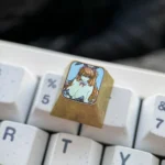 Premium titanium Asuka Bunny Girl artisan keycap from various angles. Showcases vibrant anime detail, a gleaming metallic finish, and its high-quality titanium alloy.
