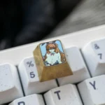 Detailed gallery views of the premium titanium Asuka Bunny Girl artisan keycap, highlighting its vibrant anime art and metallic finish.