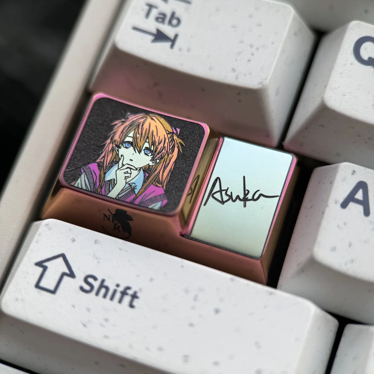 Iconic Asuka Titanium Artisan Keycap for 1.75U Caps Key, showcasing its polished finish and detailed anime character art from multiple premium angles.