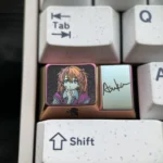 Iconic Asuka Titanium artisan keycap, 1.75U Caps Key, showcasing bold anime art on polished metal for a premium, futuristic keyboard.
