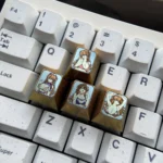 Vibrant Asuka Langley Soryu premium titanium artisan WASD keycaps, featuring dynamic Evangelion designs for mechanical keyboards.