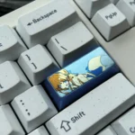 A collection of vibrant anodized Asuma Toki Titanium keycaps, meticulously crafted. Multiple angles reveal sleek metallic finishes and dynamic multi-tone colors,