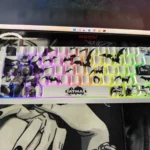 Close-up views of the iconic Batman side-engraved PBT keycap set, highlighting the mysterious Gotham aesthetic and subtle shine-through legends from various angles.