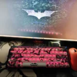 Iconic Batman side-engraved PBT keycaps set, viewed from multiple angles, reveal their subtle shine-through legends and dark, mysterious Gotham aesthetic.