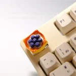 Artistic Blueberry Mille-Feuille artisan keycap. Exquisite dessert layers, vibrant blueberry, and creamy textures seen from various angles.