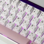 Charming Butterfly Heart-Shaped PBT Keycaps Set gallery. Whimsical pink hues dye-sublimated PBT keycaps on a romantic pastel canvas, shown artistic design.
