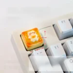 Detailed view of the adorable handcrafted cat toast artisan keycap, highlighting its whimsical sleepy cat on golden toast design.