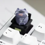 Artistic handcrafted resin Cat Worker Artisan Keycap for ESC, presented from different angles, highlighting the charming cat sculpture in a relatable design.