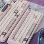 Good Night God Celestial Keycaps Set in shimmering translucent purple with stardust glitter, from multiple angles. Ethereal cosmic night sky.