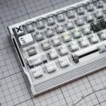 Multiple views of the Celestial Star artisan keycap set, highlighting its hollowed aluminum frame, crystal transparency, and intricate light-reactive design.